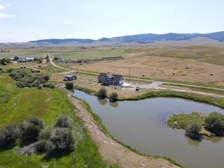 aerial view with a rural view and a water and mountain view