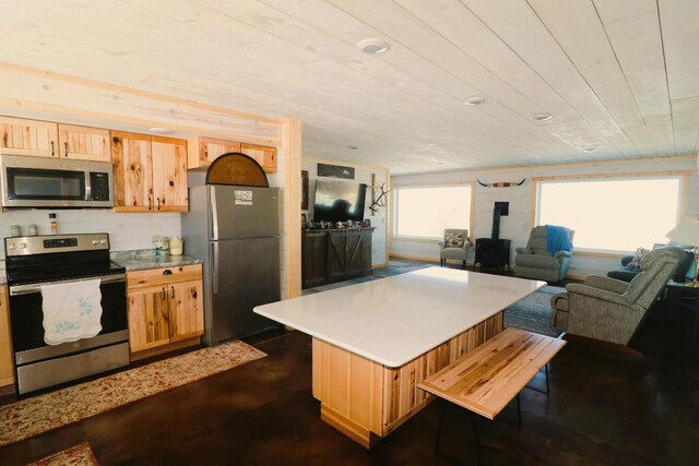 kitchen featuring stainless steel appliances and a center island