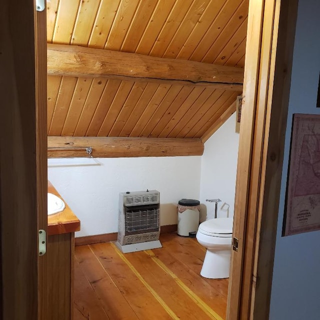 bathroom with toilet, vaulted ceiling with beams, hardwood / wood-style flooring, wooden ceiling, and vanity