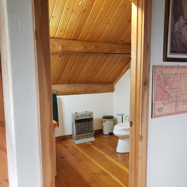 bathroom featuring hardwood / wood-style floors, lofted ceiling with beams, toilet, and wooden ceiling