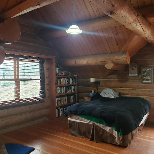 bedroom featuring wood ceiling, hardwood / wood-style floors, and vaulted ceiling