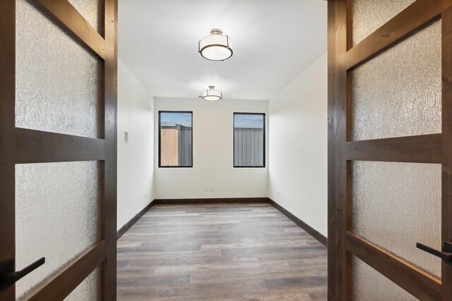 hallway featuring wood-type flooring