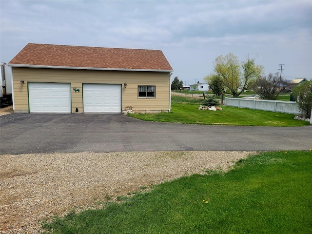 exterior space with a lawn and a garage