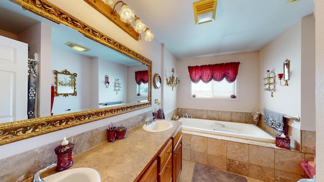 bathroom with dual sinks, oversized vanity, tiled bath, and tile floors