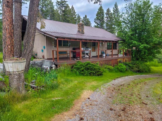 back of property with a wooden deck