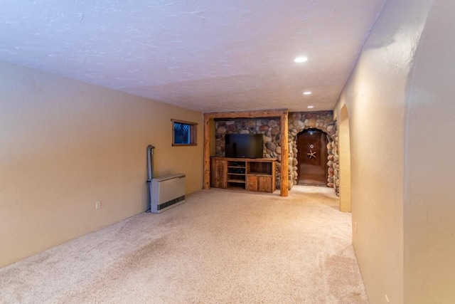 basement featuring light colored carpet