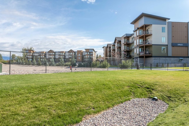 view of home's community with a yard