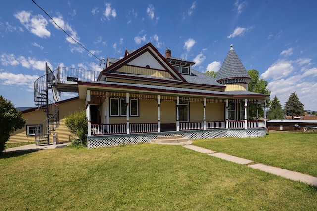 victorian home featuring a porch and a front yard