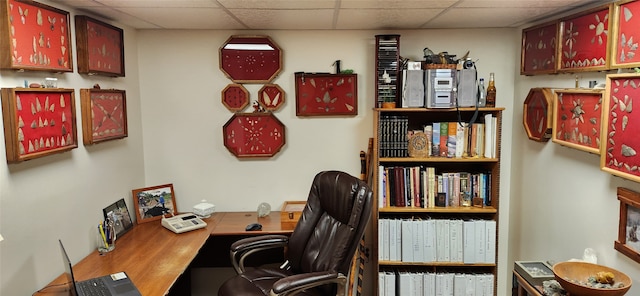 home office featuring a paneled ceiling