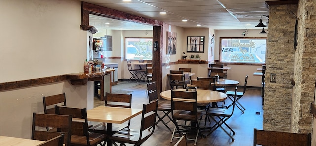 dining area with dark hardwood / wood-style flooring