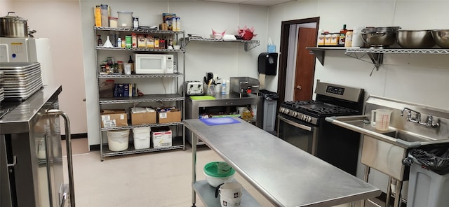 interior space featuring stainless steel counters and gas range