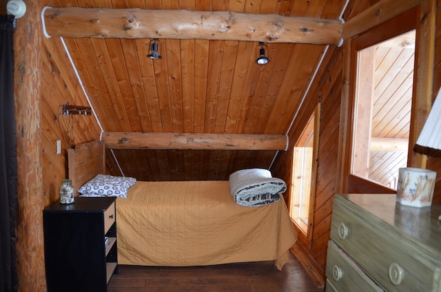 bedroom featuring dark hardwood / wood-style floors, beam ceiling, and wooden ceiling