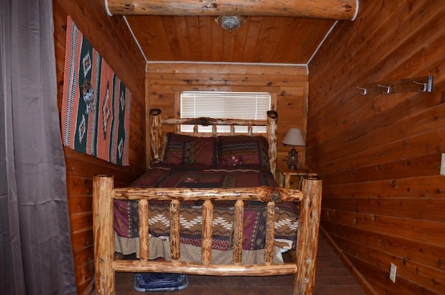 bedroom featuring beamed ceiling, wood ceiling, and wooden walls