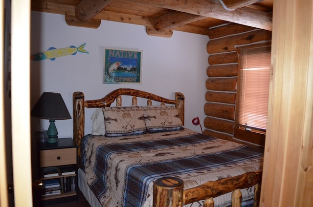 bedroom featuring beam ceiling, wood ceiling, and rustic walls