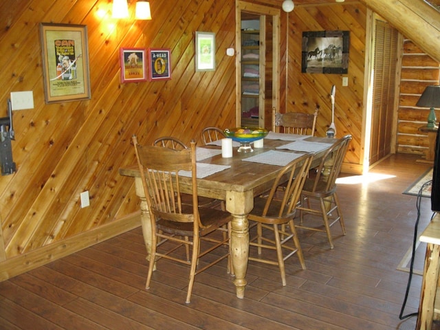 unfurnished dining area with dark wood-type flooring