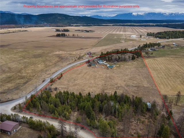 birds eye view of property featuring a rural view and a mountain view