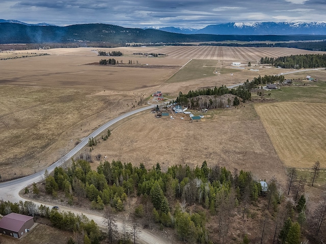 drone / aerial view featuring a mountain view and a rural view