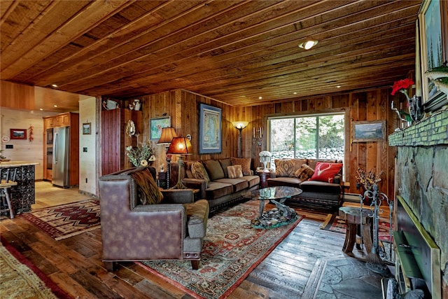 living room featuring wood walls, light wood-type flooring, and wood ceiling