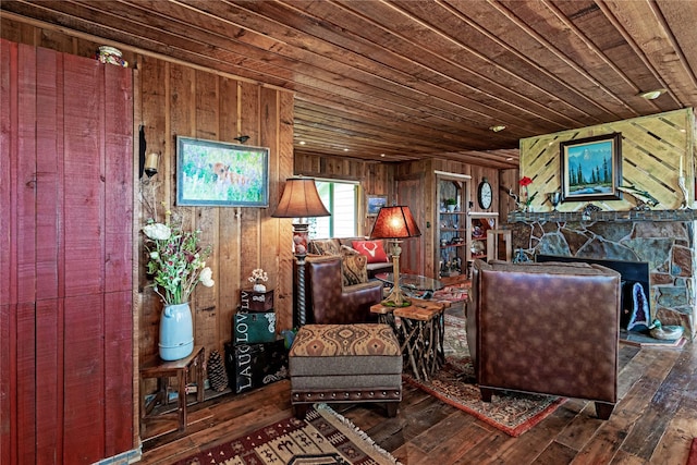 living room with hardwood / wood-style floors, wood walls, and wooden ceiling