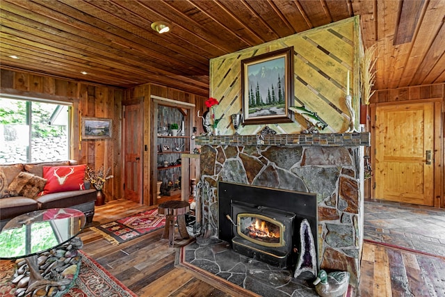 living room featuring wooden ceiling, dark wood-type flooring, and wooden walls