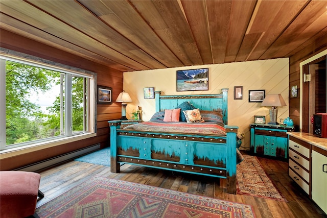 bedroom with wooden walls, a baseboard radiator, dark hardwood / wood-style floors, and wooden ceiling