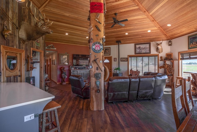 living room with dark hardwood / wood-style floors, wooden ceiling, and ceiling fan