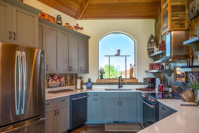 kitchen with sink, dark hardwood / wood-style flooring, dishwashing machine, stainless steel refrigerator, and wooden ceiling