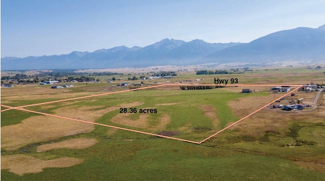 aerial view with a mountain view and a rural view