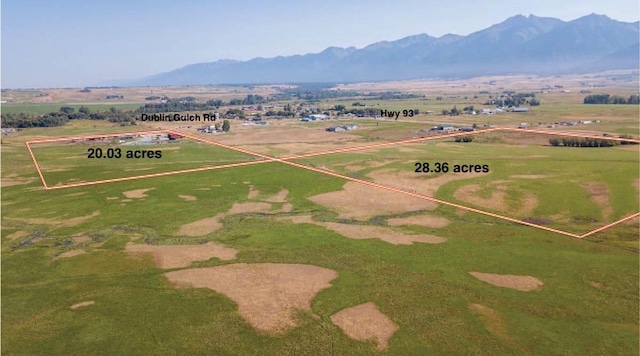 drone / aerial view featuring a mountain view and a rural view