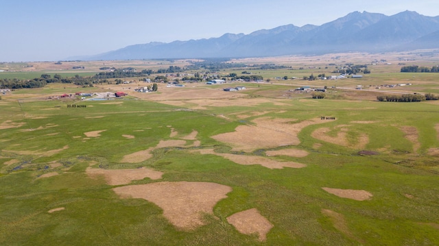 drone / aerial view featuring a rural view and a mountain view