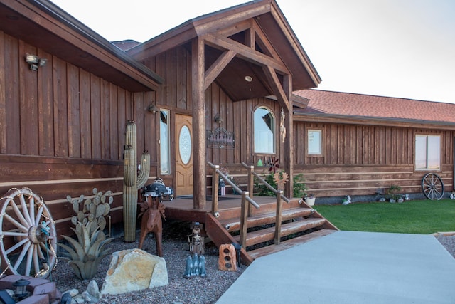 property entrance featuring a patio area