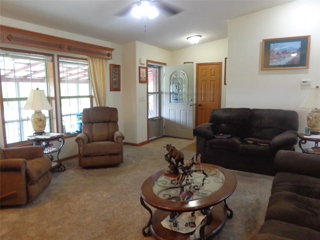 living room with light carpet and ceiling fan