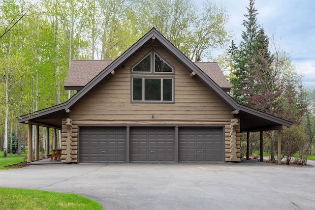 view of side of property with a garage