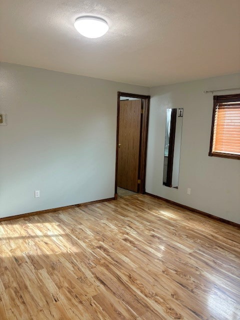 unfurnished room featuring light wood-type flooring