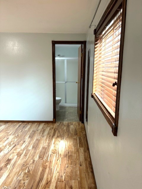 corridor featuring dark tile flooring