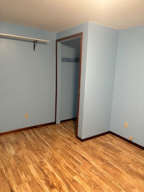 unfurnished bedroom with light hardwood / wood-style floors