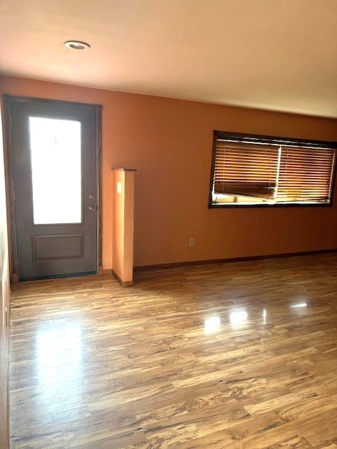 unfurnished room with light hardwood / wood-style flooring