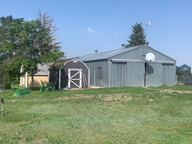 view of outdoor structure featuring a lawn