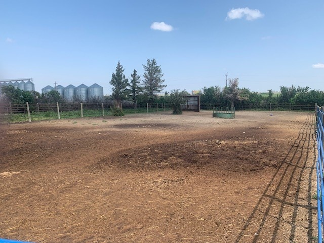 view of yard with a rural view