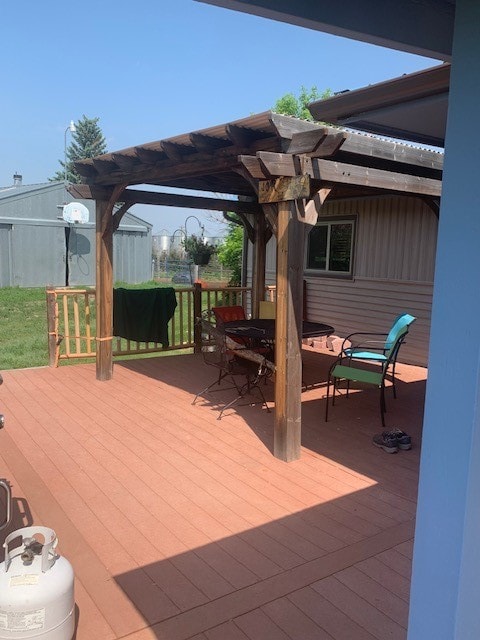 wooden deck with a pergola