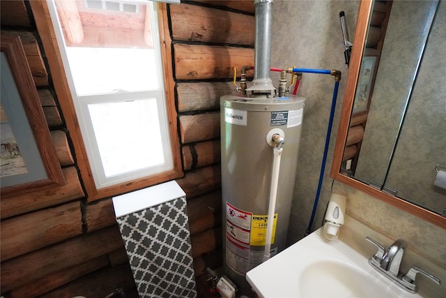 utilities featuring sink and water heater