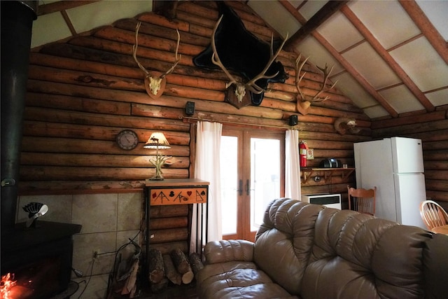 living room with rustic walls, high vaulted ceiling, french doors, beamed ceiling, and a wood stove