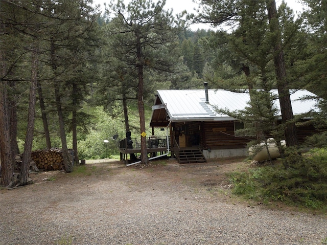 view of front of property with a wooden deck