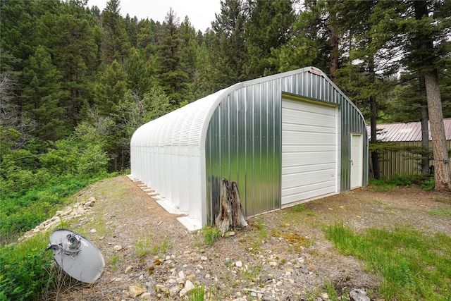 view of outdoor structure with a garage