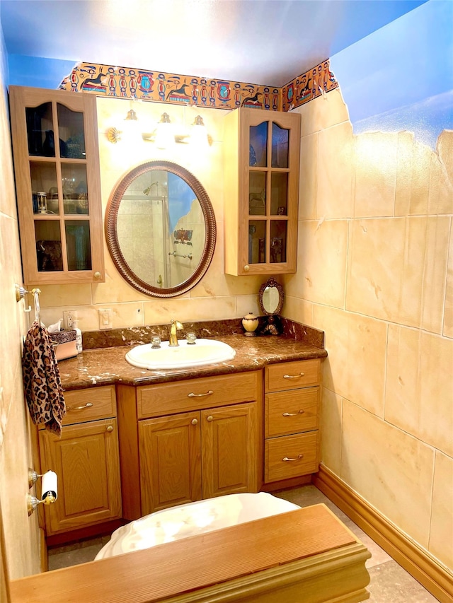 bathroom with tile walls and vanity