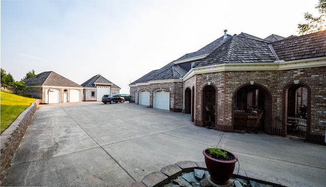 view of side of property with a garage