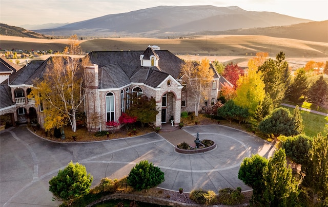 birds eye view of property with a mountain view