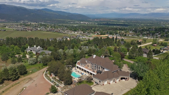 birds eye view of property featuring a mountain view