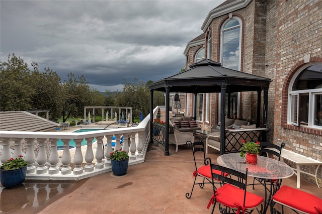 view of patio / terrace featuring a gazebo and outdoor lounge area