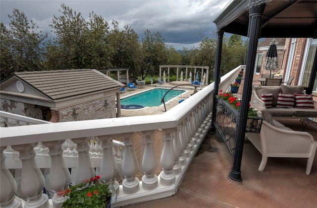 view of pool with an outdoor hangout area and an outdoor structure